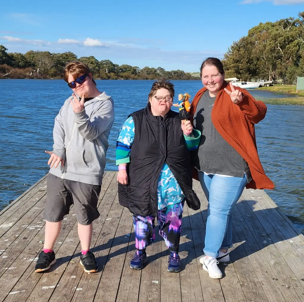 Alchemy support worker assisting a participant during a murray bridge community activity